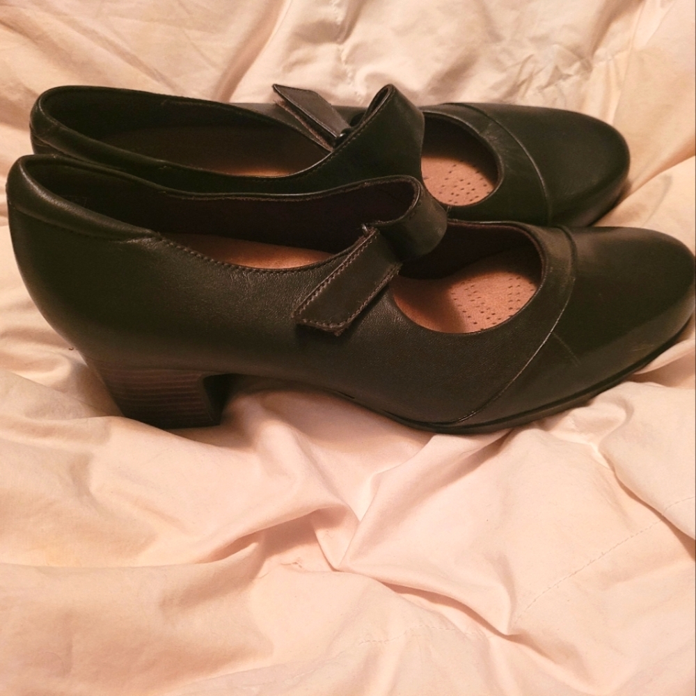 Clark's Brown shoes with strap. 1 inch clunky heel. Lightly used. Size 12 Wide.
